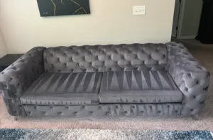 Gray velvet Chesterfield with soft, groomed cushions after couch cleaning in Atlanta, GA by a trained Couch Steamers tech