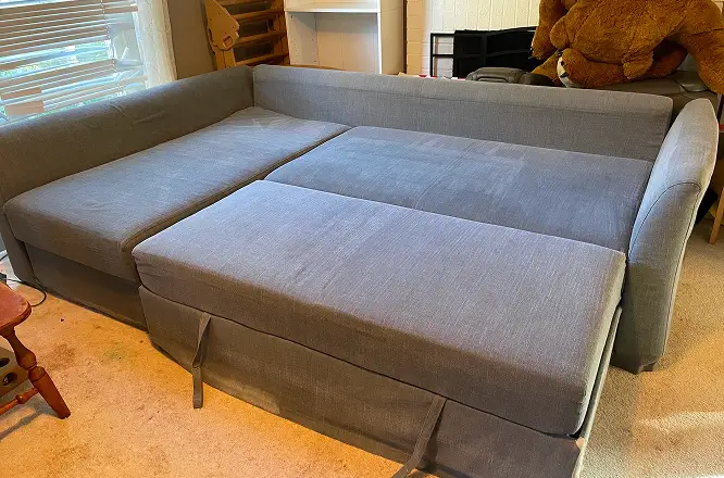 Large sectional couch after heavy dirt cleaning and upholstery deep cleaning with improved fabric appearance in Raleigh, NC.