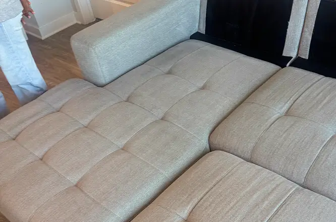 Light sectional couch seating area after general refresh upholstery cleaning with improved fabric appearance in Raleigh, NC.