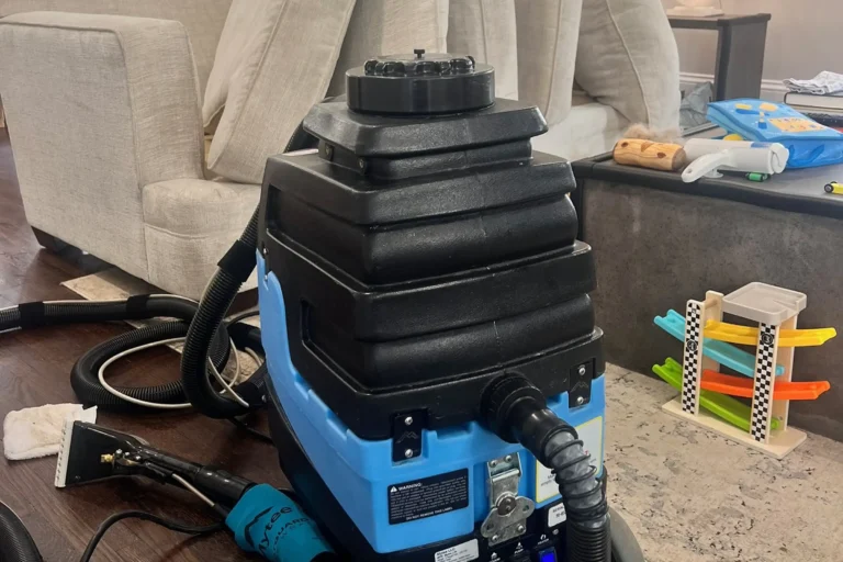Professional upholstery cleaning machine used by a couch cleaning company near me for safe fabric cleaning on sofas and chairs