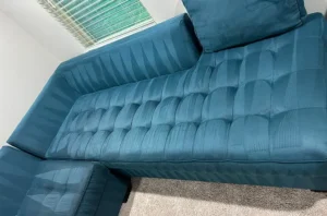 Blue sectional after steam couch cleaning in Dallas, TX, showing deep color restored and old stains fully washed out.