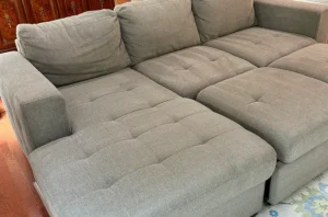 Beige sectional after a general refresh and settee cleaning in Dallas, TX, looking soft, bright, and evenly clean.