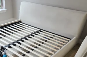 Same white headboard after steam mattress cleaning, with pet stains gone and the fabric clean and odor free.