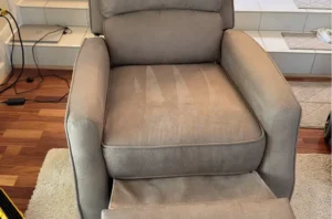 Beige recliner with fresh grooming lines after upholstery fabric cleaning services and full pet stain removal