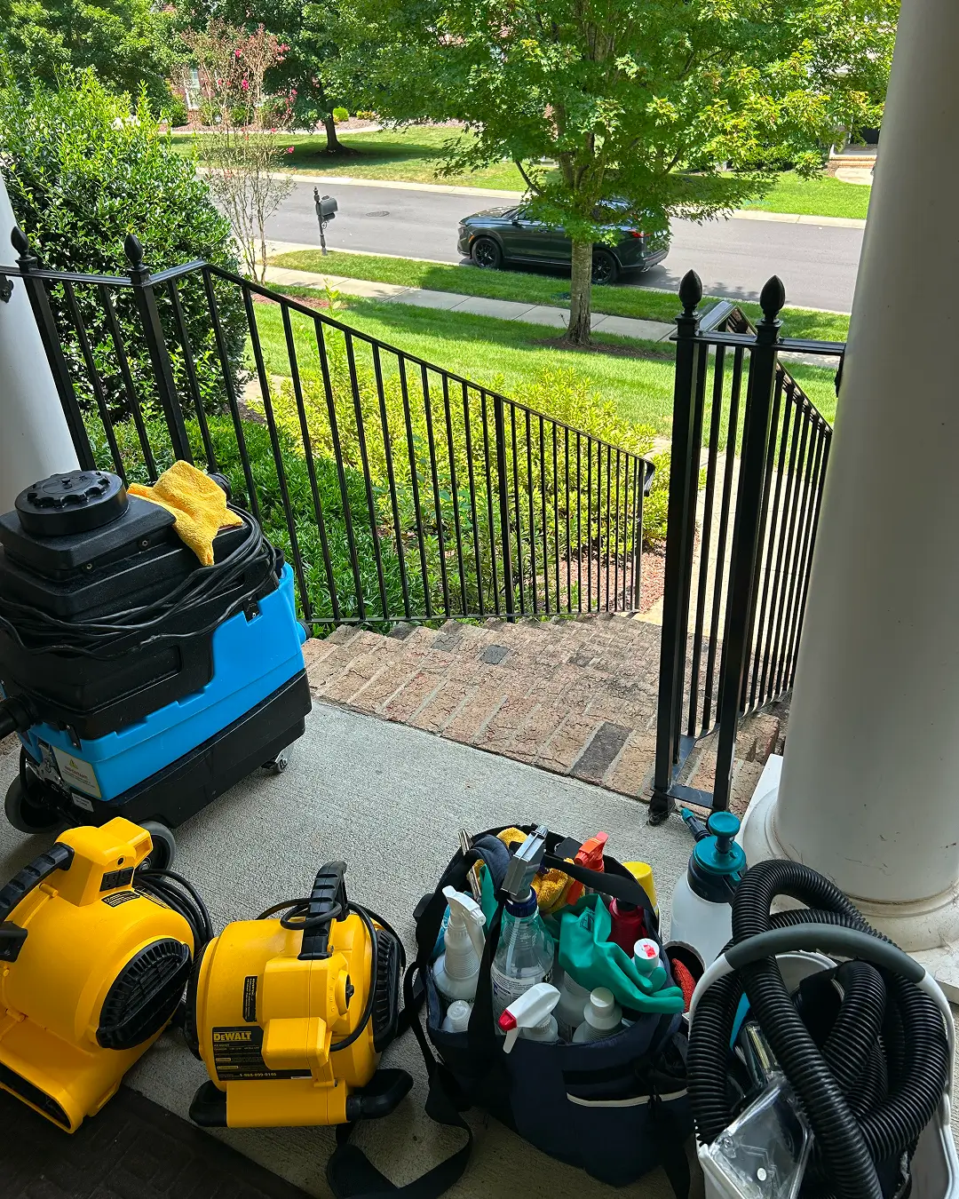 Couch Steamers extractor, air mover, and supplies ready on a porch. Trusted mattress cleaning gear for a fresh, healthy sleep.