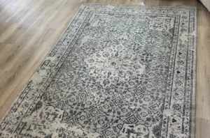 Same oriental rug after rug cleaning, with pet stains lifted and the pattern looking crisp, bright, and clean.